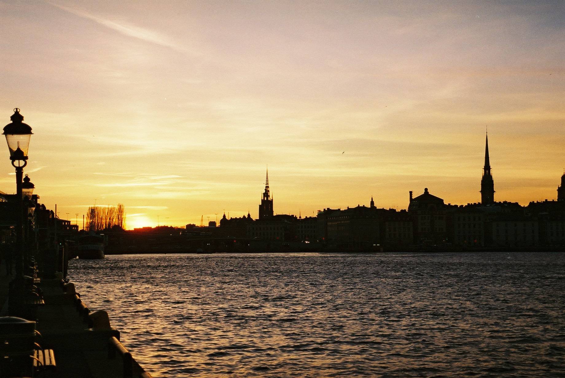 view of the river and the silhouette of the city skyline just before the sunset